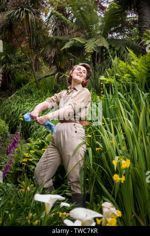 Actor Emily Faulkner performing in a scene from the theatre production called Operation Neptune in the grounds of Trebah Garden in Cornwall.  The open Stock Photo