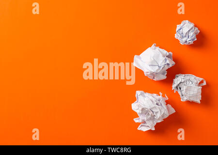 Flat lay composition with crumpled paper balls on color background, space for text Stock Photo