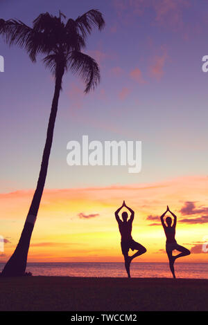 Silhouette of a woman meditating at the sunset Stock Photo - Alamy
