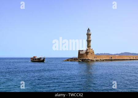 Excursion boat cruising Venetian harbour and mediterranean sea of Chania, Crete, Greece Stock Photo