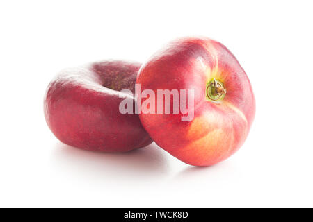 Ripe flat nectarines isolated on white background. Stock Photo