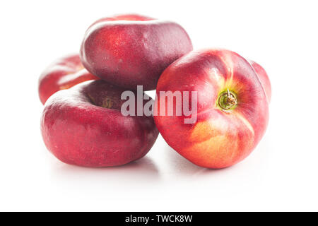 Ripe flat nectarines isolated on white background. Stock Photo