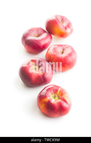 Ripe flat nectarines isolated on white background. Stock Photo
