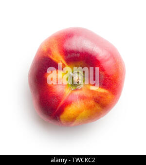 Ripe flat nectarine isolated on white background. Stock Photo