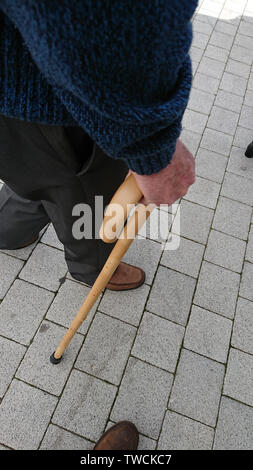 Man with walking stick Stock Photo