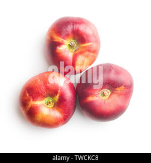 Ripe flat nectarines isolated on white background. Stock Photo