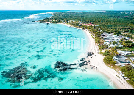 Aerial drone view at luxury resorts and coastline at Belle Mare beach on island Mauritius. Toned image. Stock Photo