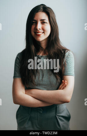 young confident brunette woman smiling Stock Photo