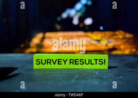 Survey Results! on the sticky notes with bokeh background Stock Photo