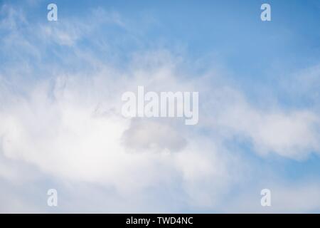 Light blue sky with soft cirrocumulus clouds. Beautiful sky background Stock Photo