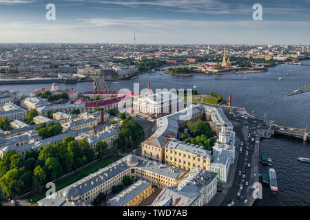 Old Stock Exchange building, Rostral columns, Peter and Paul fortress on  background, boats on the Neva river, bridges, embankment Stock Photo