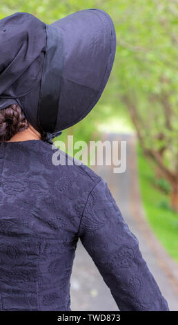 Dark-haired Victorian woman in black ensemble Stock Photo