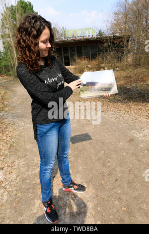 Eastern Europe, Ukraine, Pripyat, Chernobyl. Guide showing what area formerly looked like. April 11, 2018. Stock Photo