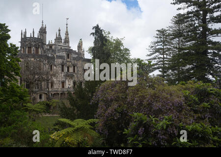 Garden view of the main house at UNESCO World Heritage Site of The Quinta da Regaleira AKA The Palace of Monteiro the Millionaire, Sintra, Portugal. Stock Photo