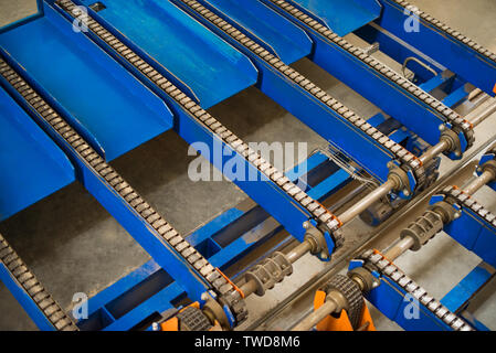 Old industrial chain unloading system products. Stock Photo
