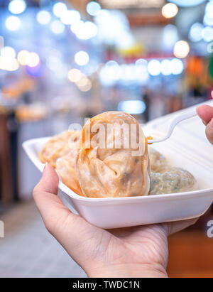 Delicious steamed round shaped dumplings in South Korea traditional market, special korean street food cuisine, close up, bokeh, copy space Stock Photo