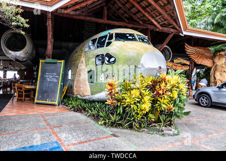 El Avión, in Manuel Antonio, is a popular bar and restaurant in Costa Rica. The centerpiece of the restaurant is a hollowed out C-123 cargo plane. Stock Photo