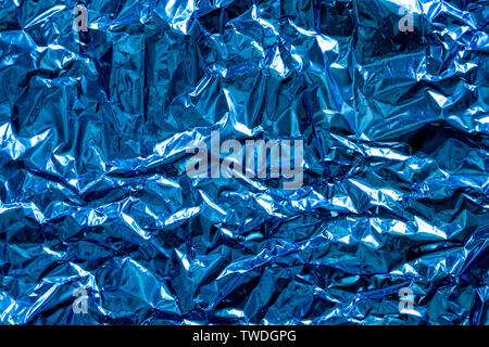 Texture of crumpled blue foil plastic. Concept of global Warming. Stock Photo