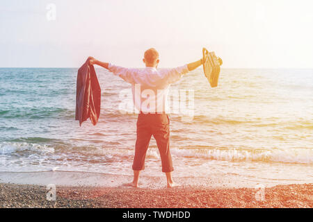Businessman Raising His Hands or Open arms when sun rising up Stock Photo