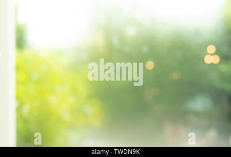 Blur of abstract green garden background from window view Stock Photo