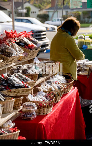 Selling baked goods at the local farmer's market Stock Photo