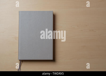 Silver diary on a light table. Stock Photo