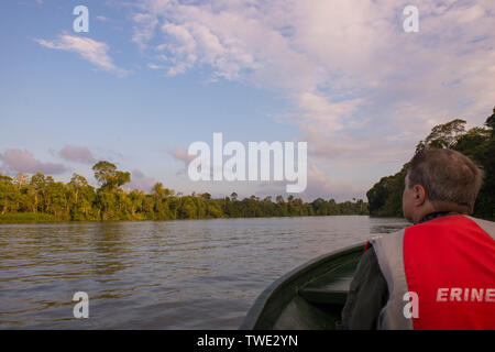 Tourists on a boat on the Kinabatangan River, Sabah, Borneo, East Malaysia. Stock Photo