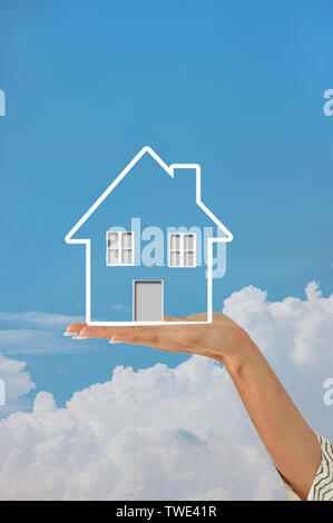 Human hands holding a dream house Stock Photo