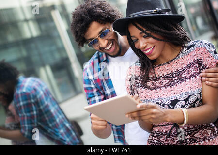 Close up portrait of happy young black couple using a digital tablet together Stock Photo