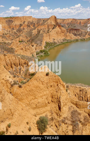 Red clay erosion gully and river. Eroded landscape. Toledo, Spain Stock Photo
