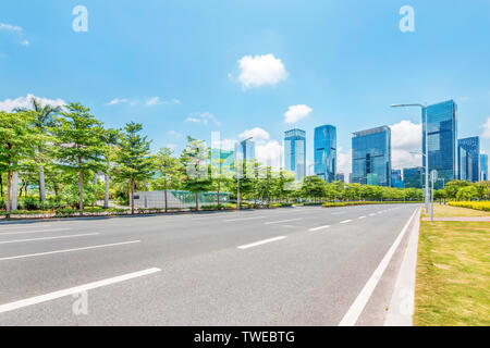 asphalt road and skyscrapers of modern city Stock Photo