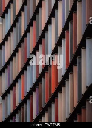 Colored window shutters on a large wall Stock Photo