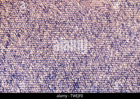 Closeup of a blue and white speckled floor carpet with loops Stock Photo