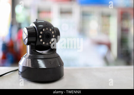 Installation of standing CCTV camera for surveillance on the table Stock Photo
