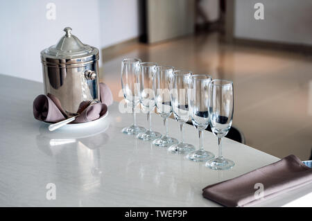 Arrangement of wine glass with stainless bucket on marble bar Stock Photo