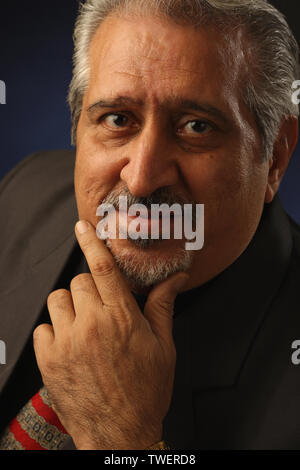 Portrait of a businessman with hand on chin Stock Photo