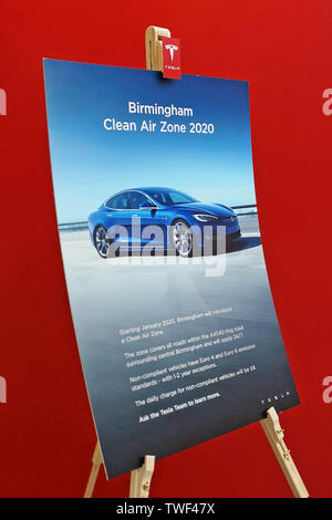 Tesla sales branch in Touchwood Solihull, UK, shows a sign for Birmingham Clean Air Zone 2020. June 18. 2019. Stock Photo