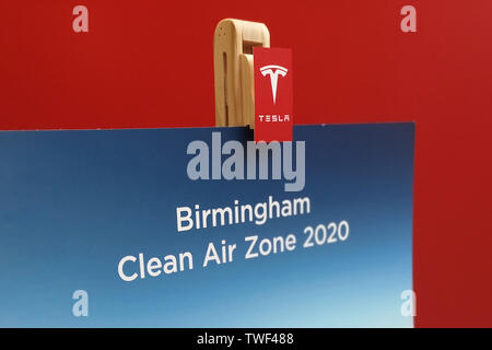 Tesla sales branch in Touchwood Solihull, UK, shows a sign for Birmingham Clean Air Zone 2020. June 18. 2019. Stock Photo