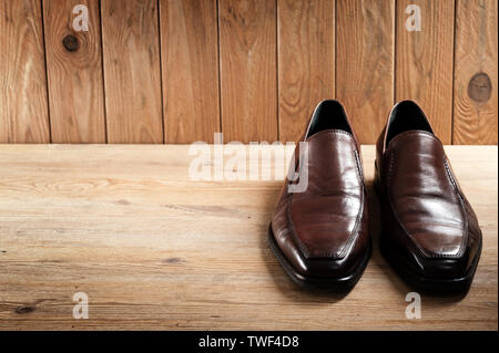 brown leather shoes for men, luxury leather shoes on wooden background Stock Photo