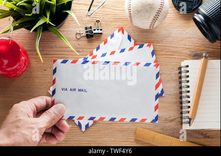 air mail envelope on the wood table Stock Photo