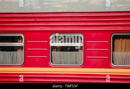 Three Windows of the red sleeping car. Stock Photo