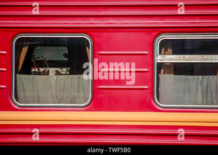 Two Windows of the red sleeping car. Stock Photo