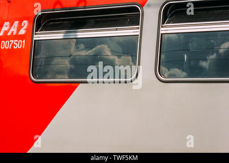 20.06.2019 Bryansk. Russia.Two Windows of the red sleeping car. Stock Photo