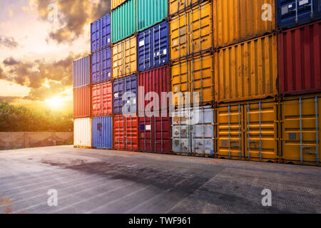 stack of containers with empty road in front Stock Photo