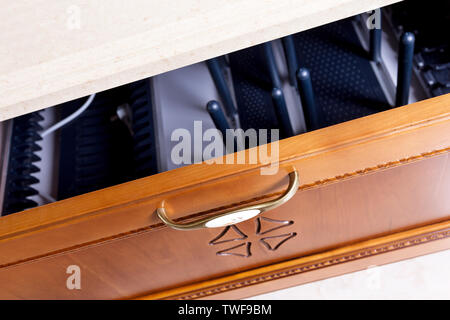 wooden cupboard with opened empty drawer Stock Photo