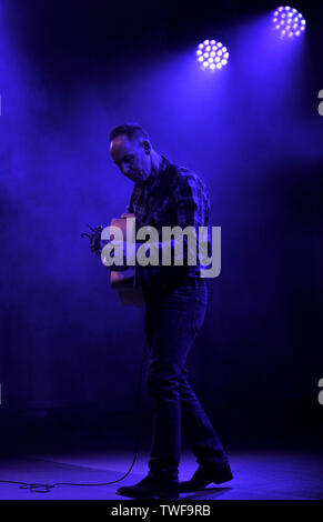 Former Aztec Camera musician Roddy Frame performs a solo acoustic set at the Kelvingrove Bandstand, Glasgow Stock Photo
