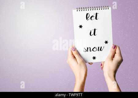 Woman Hand Holding Blank Spiral Notepad. Stock Photo
