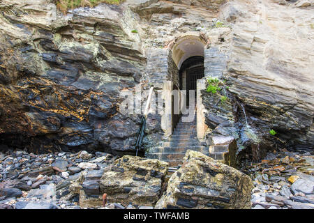 The historic disused entrance to the tunnel leading from Great Western Beach to the Hotel Victoria in Newquay in Cornwall. Stock Photo