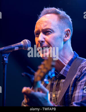 Former Aztec Camera musician Roddy Frame performs a solo acoustic set at the Kelvingrove Bandstand, Glasgow Stock Photo