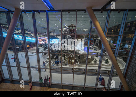 Children play in the snow at Ski Dubai at the Mall of the Emirates. Stock Photo